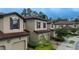 Townhouse exterior, two-car garage, and landscaped walkway at 8153 Roseville Rd, Davenport, FL 33896