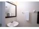 Small bathroom with white sink and vanity mirror at 8153 Roseville Rd, Davenport, FL 33896