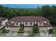 Aerial view of townhouses with a brown tile roof at 8153 Roseville Rd, Davenport, FL 33896