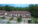Aerial view of townhouses with a brown tile roof at 8153 Roseville Rd, Davenport, FL 33896