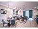 Open living area with seating, dining, and natural light at 8153 Roseville Rd, Davenport, FL 33896