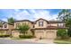 Two-story townhome with attached garage and landscaping at 8153 Roseville Rd, Davenport, FL 33896