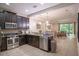 Modern kitchen with dark cabinets and stainless steel appliances at 8153 Roseville Rd, Davenport, FL 33896
