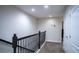 Upstairs hallway with neutral walls and carpeted flooring at 8153 Roseville Rd, Davenport, FL 33896