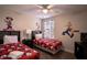 Themed bedroom with twin beds, featuring Mickey Mouse decor at 8153 Roseville Rd, Davenport, FL 33896
