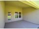 Covered patio with access door and window at 1273 Tagliamento Ln, Haines City, FL 33844
