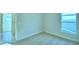 Bedroom with carpet, window, and access to a hallway at 1273 Tagliamento Ln, Haines City, FL 33844