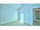 Bedroom with carpet flooring and access to bathroom at 1273 Tagliamento Ln, Haines City, FL 33844