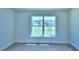Bright bedroom with a large window offering a view at 1261 Tagliamento Ln, Haines City, FL 33844