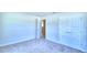 Bright bedroom with double door closet and carpet flooring at 1261 Tagliamento Ln, Haines City, FL 33844
