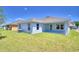 View of the home's back and side yards at 1261 Tagliamento Ln, Haines City, FL 33844