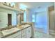 Double vanity bathroom with soaking tub and shower at 1261 Tagliamento Ln, Haines City, FL 33844