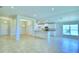 Bright and spacious living room with tile floors and an open floor plan at 1261 Tagliamento Ln, Haines City, FL 33844