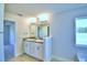 Double vanity bathroom with granite countertop at 1261 Tagliamento Ln, Haines City, FL 33844
