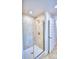 Walk-in shower with glass enclosure and tile surround at 1261 Tagliamento Ln, Haines City, FL 33844