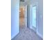 Bright hallway with carpet flooring and access to other rooms at 1261 Tagliamento Ln, Haines City, FL 33844