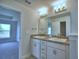 Double vanity bathroom with granite countertop at 1261 Tagliamento Ln, Haines City, FL 33844