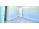 Bright bedroom with carpeted floors and access to closet at 1261 Tagliamento Ln, Haines City, FL 33844