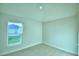 Spacious bedroom with neutral walls and carpet flooring at 1257 Tagliamento Ln, Haines City, FL 33844