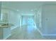 Open living area with tile floors and access to kitchen at 1257 Tagliamento Ln, Haines City, FL 33844