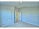 Well-lit bedroom with closet and access to another room at 1257 Tagliamento Ln, Haines City, FL 33844