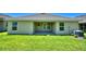 Home with covered patio and grassy backyard at 1257 Tagliamento Ln, Haines City, FL 33844