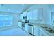 Modern kitchen with stainless steel appliances and granite countertops at 1257 Tagliamento Ln, Haines City, FL 33844