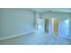Second bedroom with double door closet and carpeted floor at 1257 Tagliamento Ln, Haines City, FL 33844