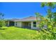 Home with covered patio and spacious backyard at 1257 Tagliamento Ln, Haines City, FL 33844
