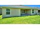 Home with covered patio and grassy backyard at 1257 Tagliamento Ln, Haines City, FL 33844