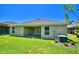 Home exterior showcasing backyard patio and lawn at 1249 Tagliamento Ln, Haines City, FL 33844