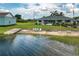 Single-story home with waterfront access and sandy beach area at 1702 Parks Lake Rd, Lake Wales, FL 33898