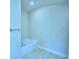 Bathroom with garden tub and tile flooring at 502 Tanaro Ln, Haines City, FL 33844