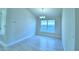 Dining area with tile flooring and a window view at 502 Tanaro Ln, Haines City, FL 33844
