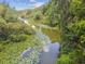 Serene river view with abundant lily pads at 9011 Whipperwill Ln, Haines City, FL 33844