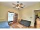 Bedroom with a full-size bed and a sleeper sofa at 1955 W Lake Hamilton Dr, Winter Haven, FL 33881