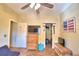 Bedroom with dresser, closet, and TV at 1955 W Lake Hamilton Dr, Winter Haven, FL 33881