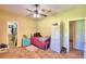 Cozy bedroom with ceiling fan and adjacent closet at 1955 W Lake Hamilton Dr, Winter Haven, FL 33881