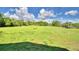 Open pasture with a wooden fence and lush green grass at 1955 W Lake Hamilton Dr, Winter Haven, FL 33881