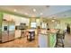 Kitchen with white cabinets, stainless steel appliances, and an island at 1955 W Lake Hamilton Dr, Winter Haven, FL 33881