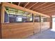 Multiple horse stalls with metal bars and wooden frames at 1955 W Lake Hamilton Dr, Winter Haven, FL 33881
