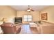 Spacious living room with ceiling fan and large windows at 1955 W Lake Hamilton Dr, Winter Haven, FL 33881