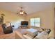 Comfortable living room featuring a large TV and ample seating at 1955 W Lake Hamilton Dr, Winter Haven, FL 33881