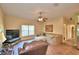 Relaxing living room with tiled floors, large TV and comfy seating at 1955 W Lake Hamilton Dr, Winter Haven, FL 33881