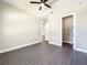 Spacious bedroom with grey flooring, ceiling fan and walk-in closet at 1793 Lakehill Dr, Winter Haven, FL 33884