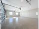Large garage featuring an epoxy floor and extra space at 1793 Lakehill Dr, Winter Haven, FL 33884