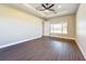 Bright main bedroom with large window and hardwood floors at 1793 Lakehill Dr, Winter Haven, FL 33884