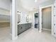 En-suite bathroom with double vanity and walk-in closet at 1793 Lakehill Dr, Winter Haven, FL 33884