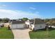 New construction home with three-car garage and paver driveway at 1793 Lakehill Dr, Winter Haven, FL 33884
