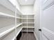Bright walk-in pantry with ample shelving for storage at 1793 Lakehill Dr, Winter Haven, FL 33884